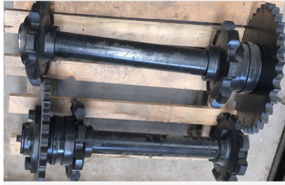 Laying machine scraper sprocket shaft assembly par